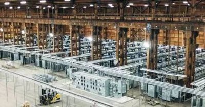 A large mining farm with numerous mining rigs set up and running.